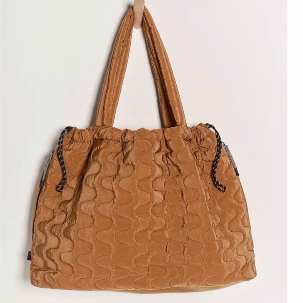 Free People Movement Cloud 9 Tote 
New with tags.   Color:Saddle